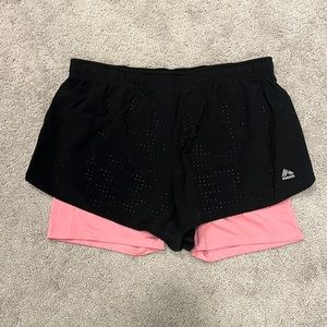 Black and Pink RBX running shorts